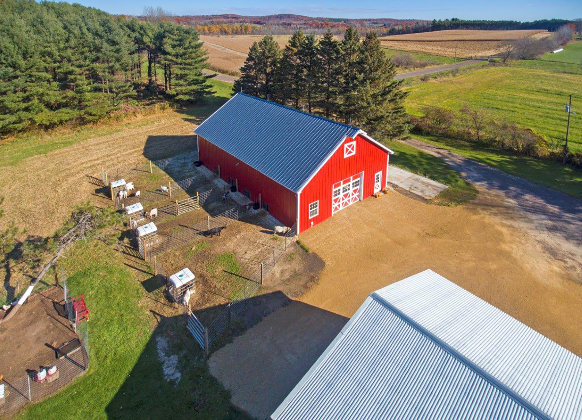 Drone view of StewBer Buildings featured goat barn building