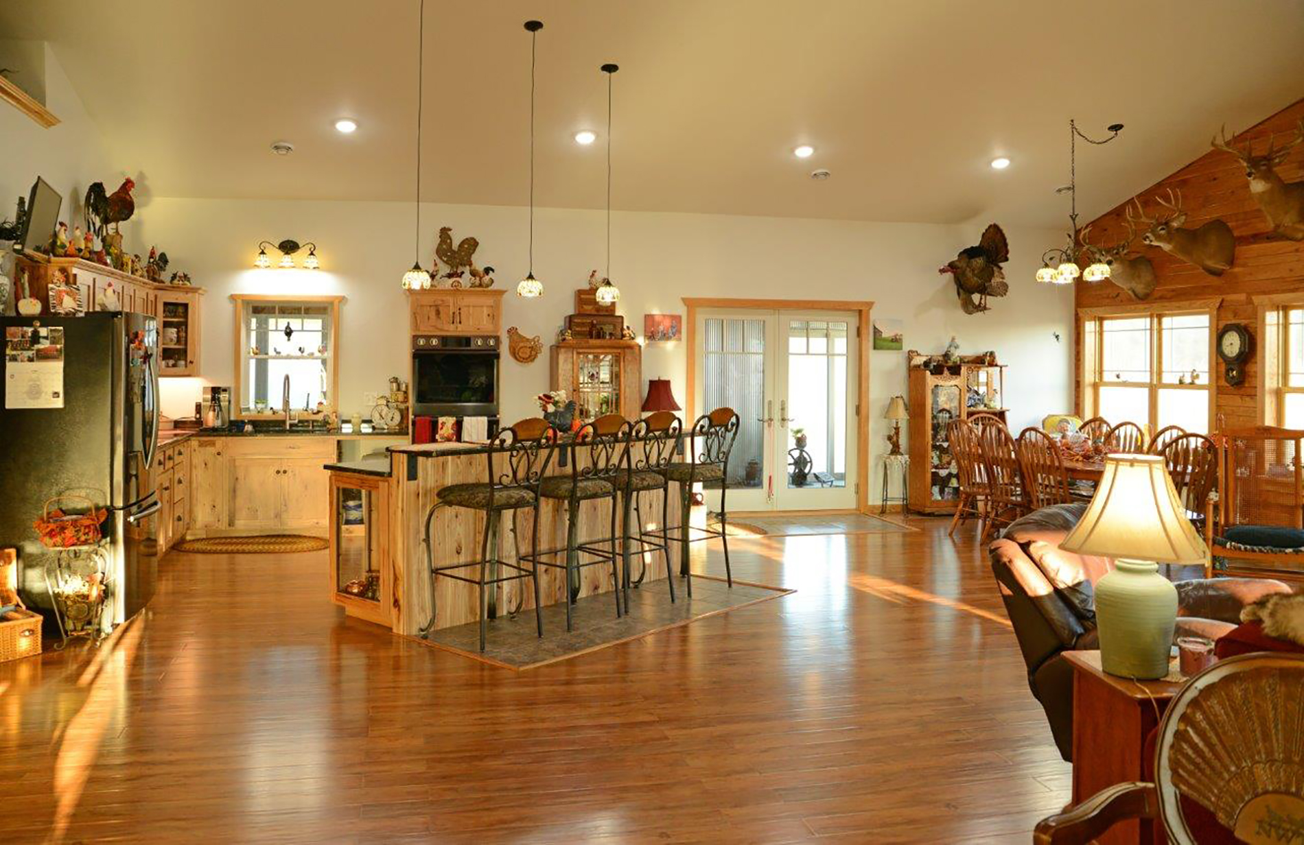 Interior of a post frame pole barn home kitchen and living room areas